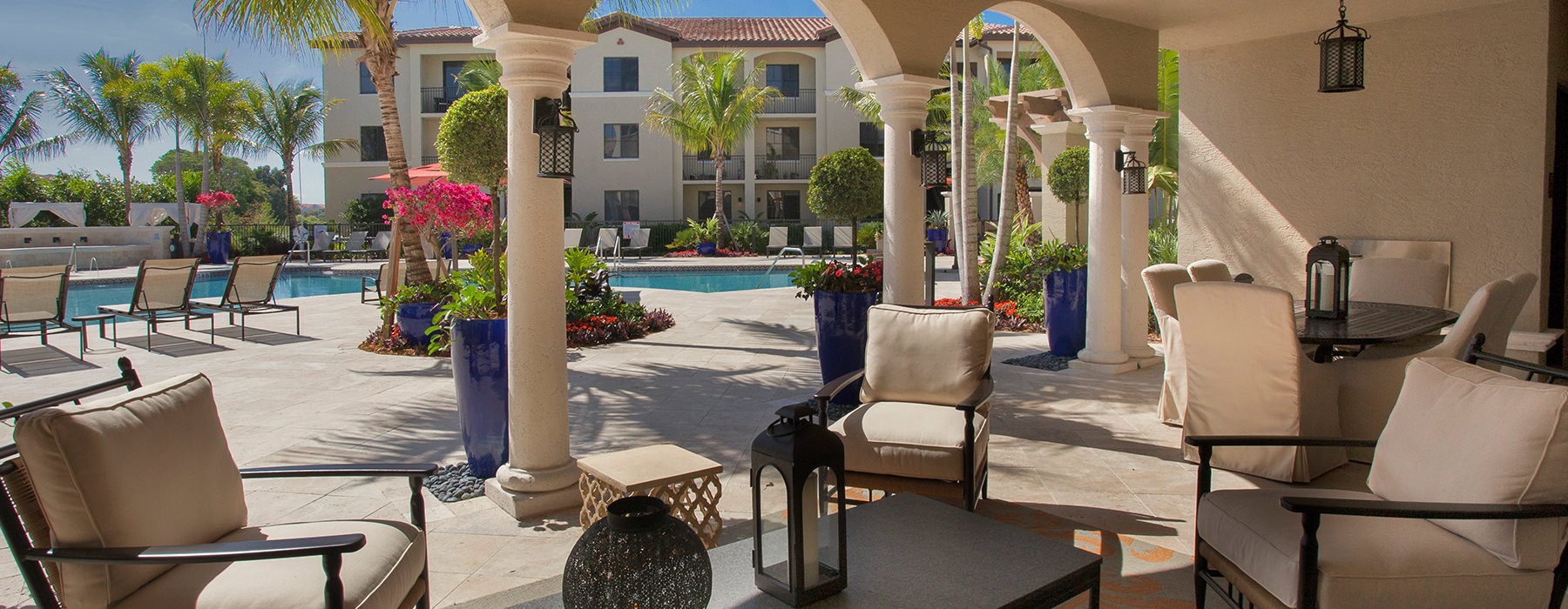 Poolside patio seating with plenty of chairs and tables